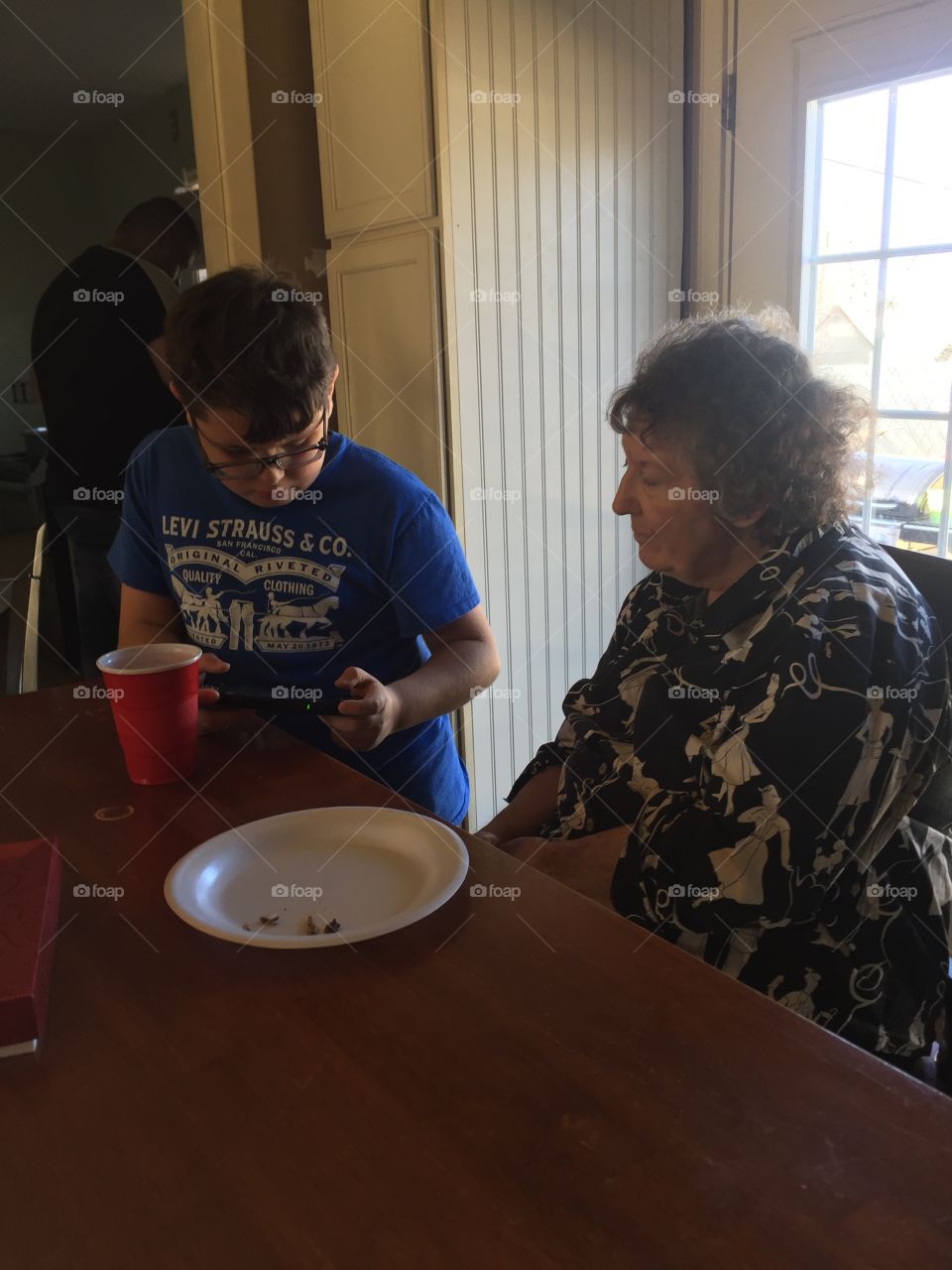 My grandmother, Anita Williams, chatting with my nephew, at a family gathering for the holidays.