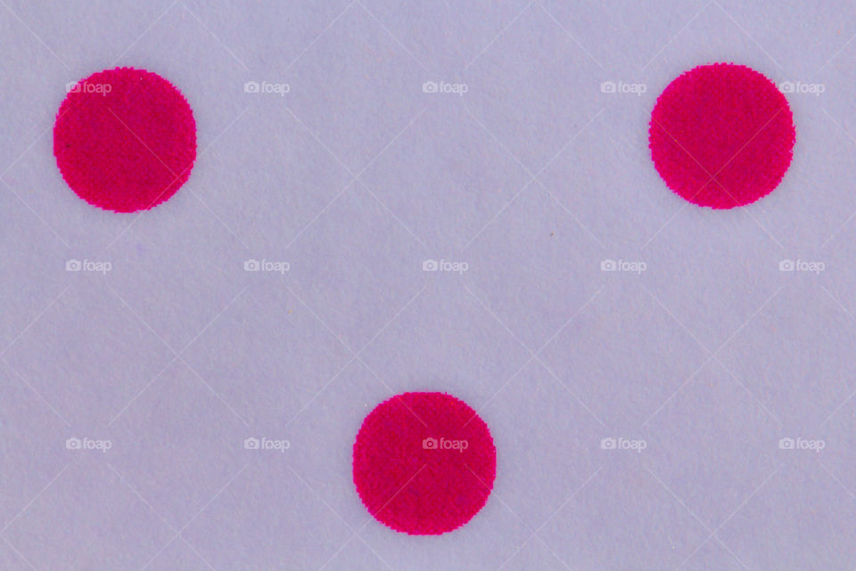 Pink polka dots on white background