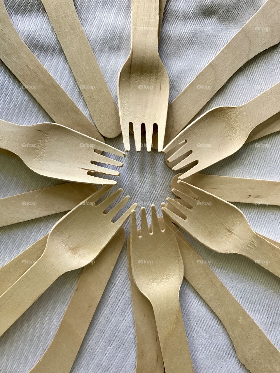 Wooden forks arranged in circles 