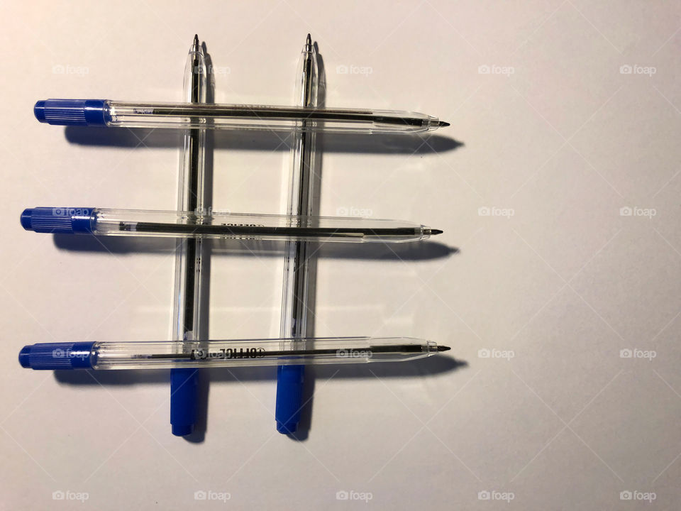 blue pens on white background