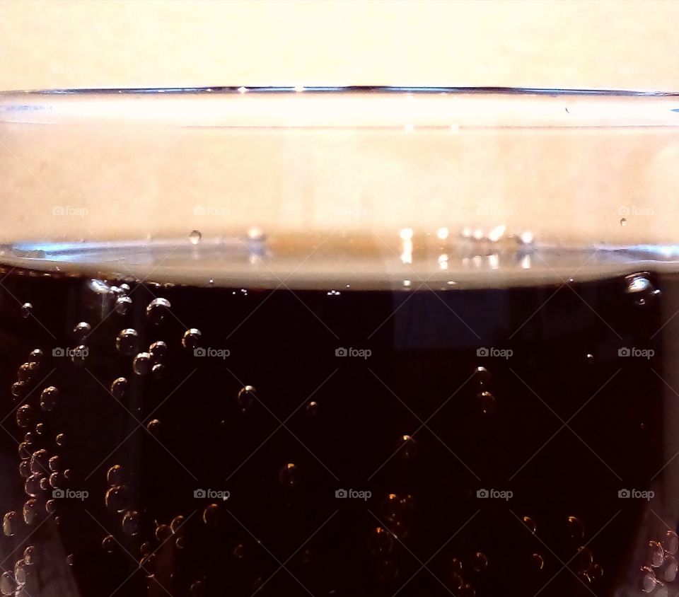 Glass of cola with bubbles