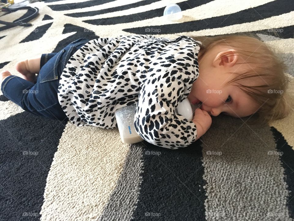 Baby laying on floor