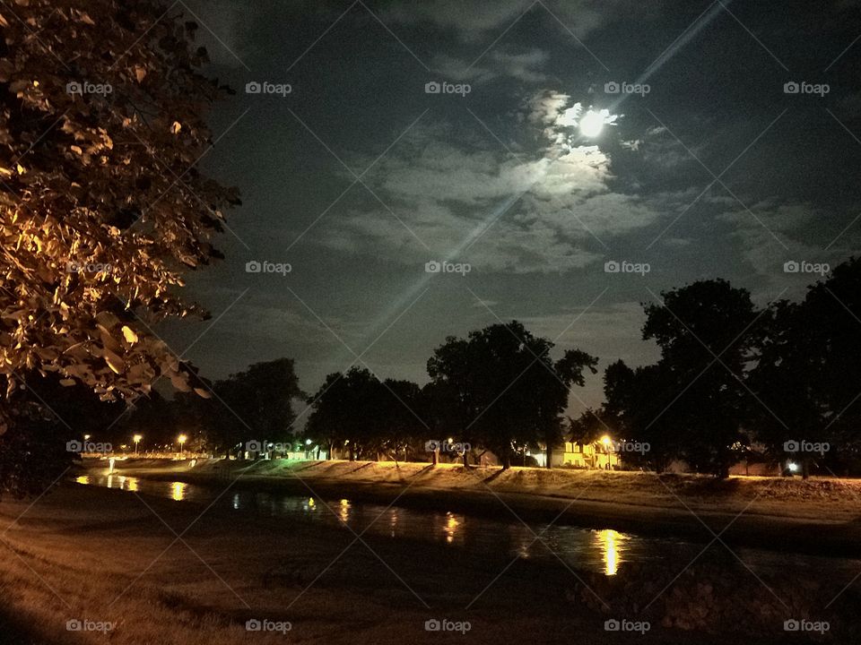 Full moon. Moon above a river.