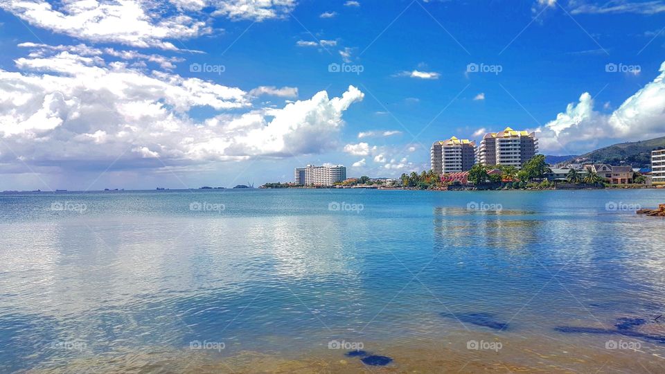 Buildings reflected on sea