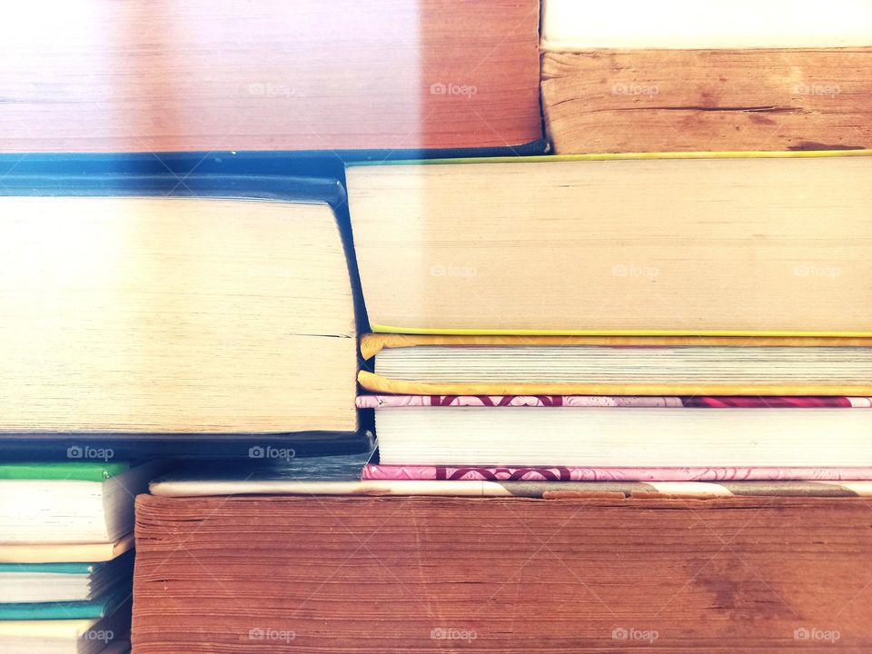 stacked books resemble rectangular brick buildings.