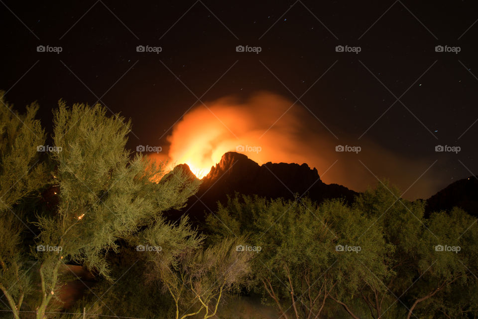 Wildfire on the mountains at night 