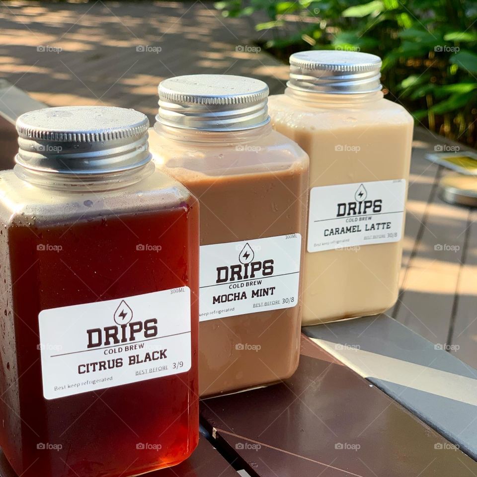 Cold brew in different flavours: citrus black coffee, mocha and caramel latte 