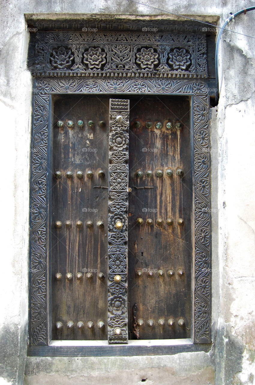 Old worn door in Stonetown on Zanzibar.