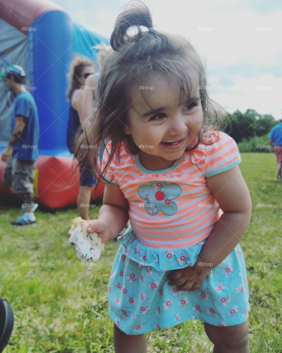 Cute girl eating cake