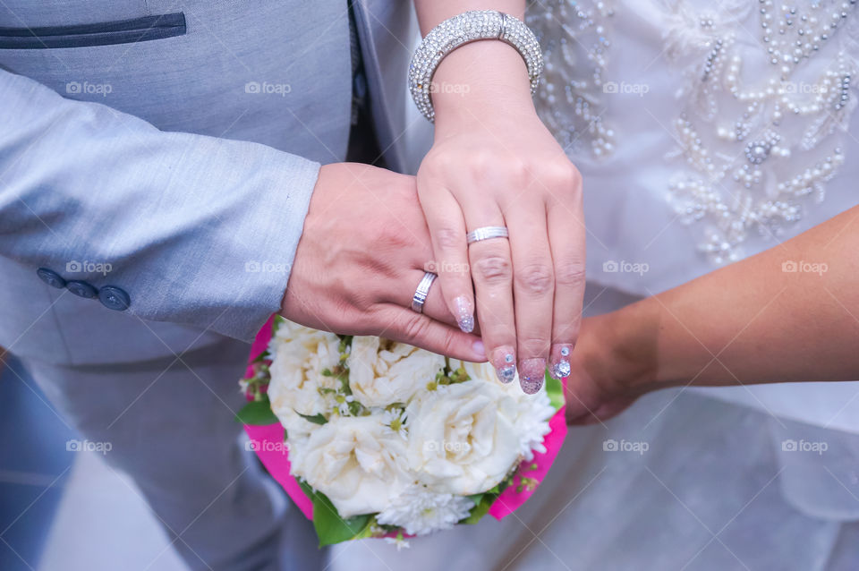 hand in hand at wedding