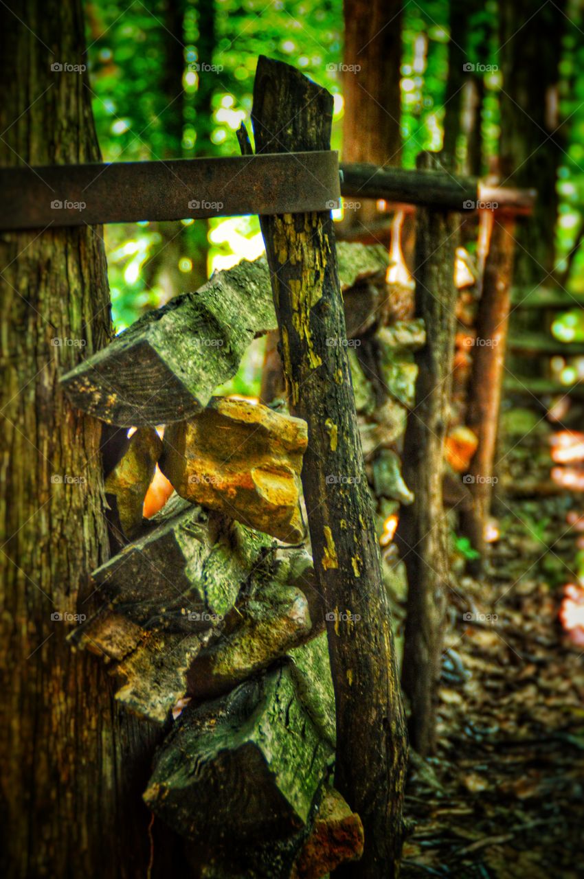 Hand-built wooden fence on a historical and rustic homestead.