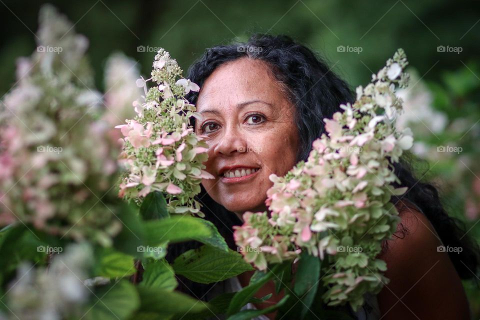 Woman in hydrangeas