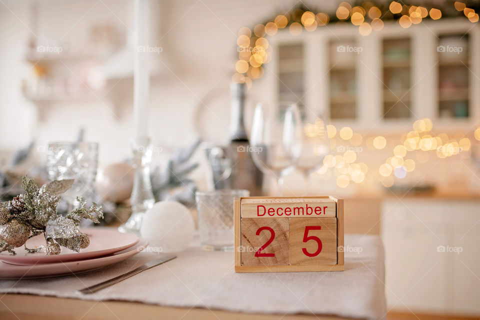 Christmas background with wooden block calendar with the date of December 25