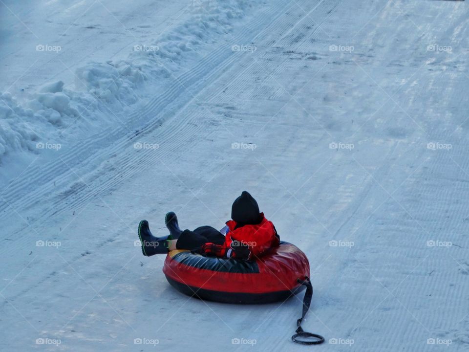 Sledding In The Snow
