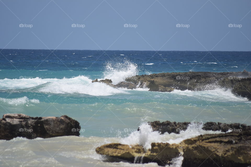 Beautiful waves crashing into rocks!