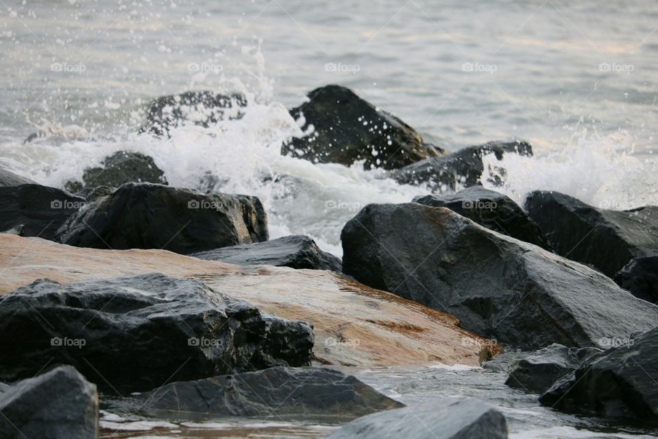 Waves crashing on rocks