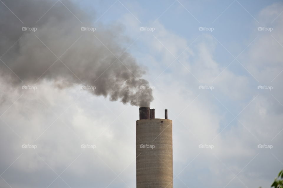 The Smoking Chimney. Air Polluting