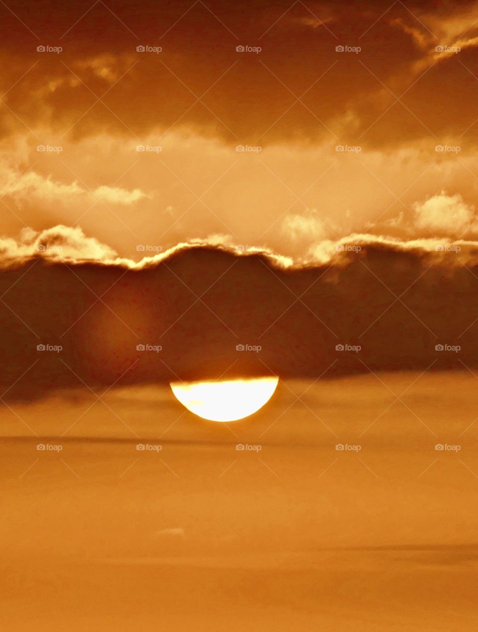 The sunset was a perfect conclusion of the day. It was silky, smooth collusion of sky burst reds, yellows, various hues, orange, tangerine and metallic gold