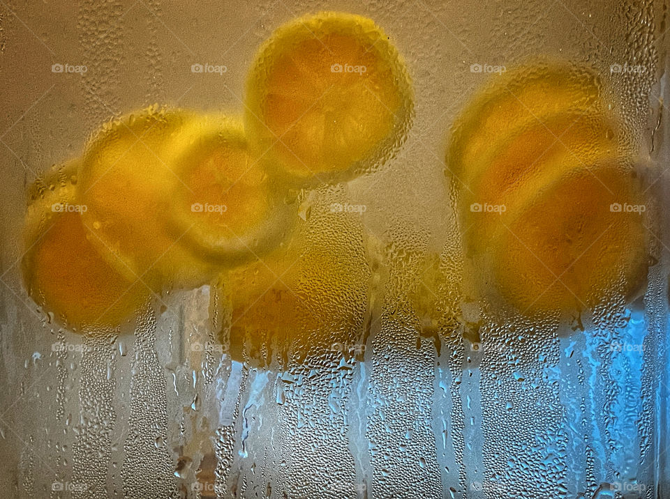 Lemon slices floating in cold water