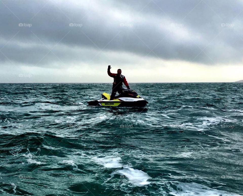 Man Jet skiing in a storm in Weymouth 
