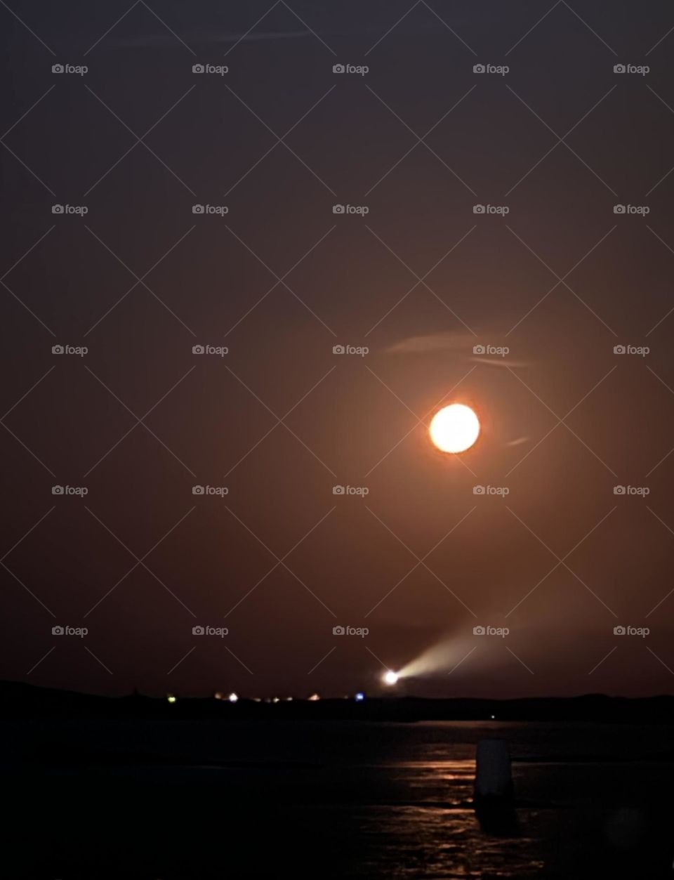 Lights from the moon and the lighthouse 