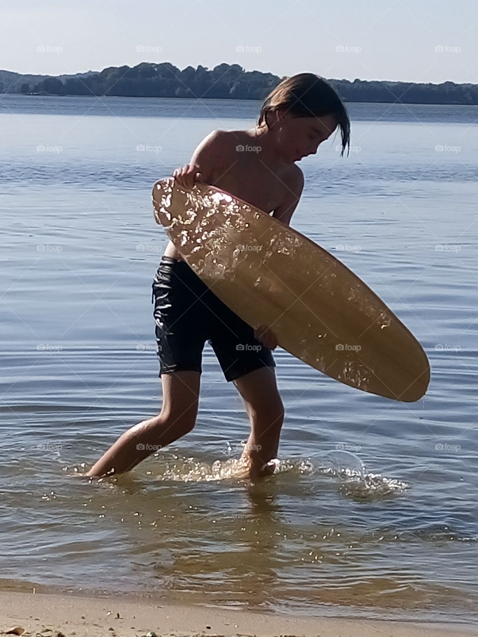 my kid and skimboarding