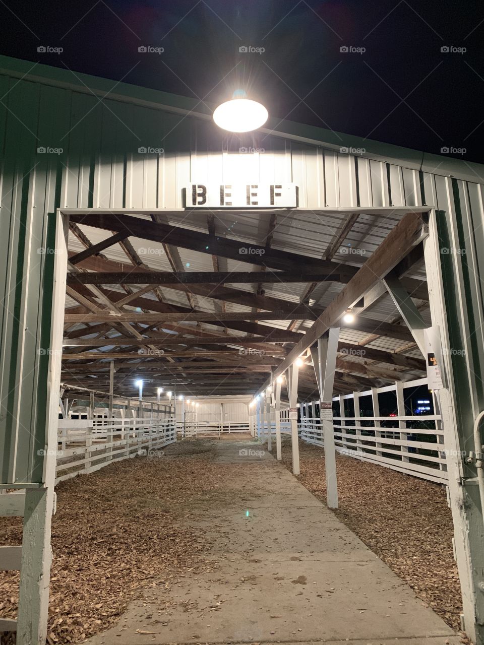 Empty stalls of an open-air barn for cattle before being shown in competition at a county fair