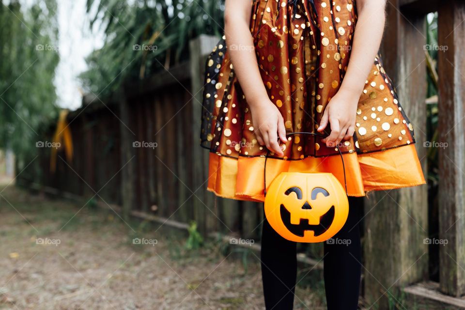 Kid celebrating Halloween outdoor 