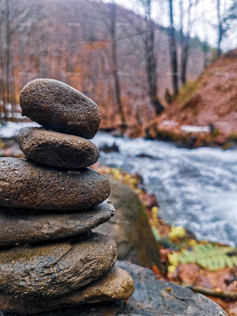 Early spring landscape with round rocks and river is full of peacefulness and beauty 