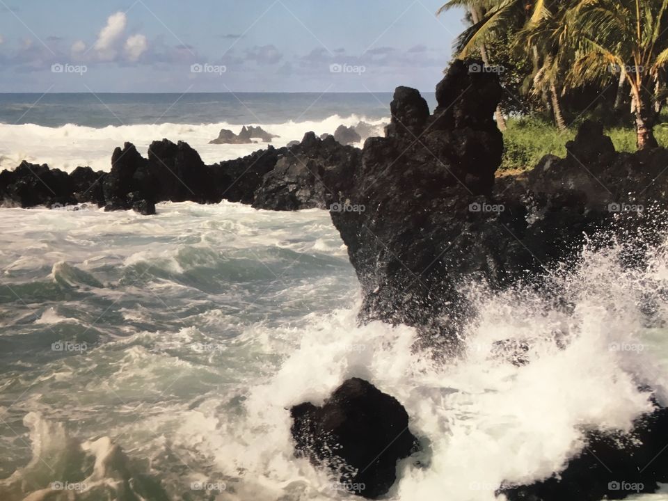 Waves crashing ashore on the Road to Hana in Maui, Hawaii, USA