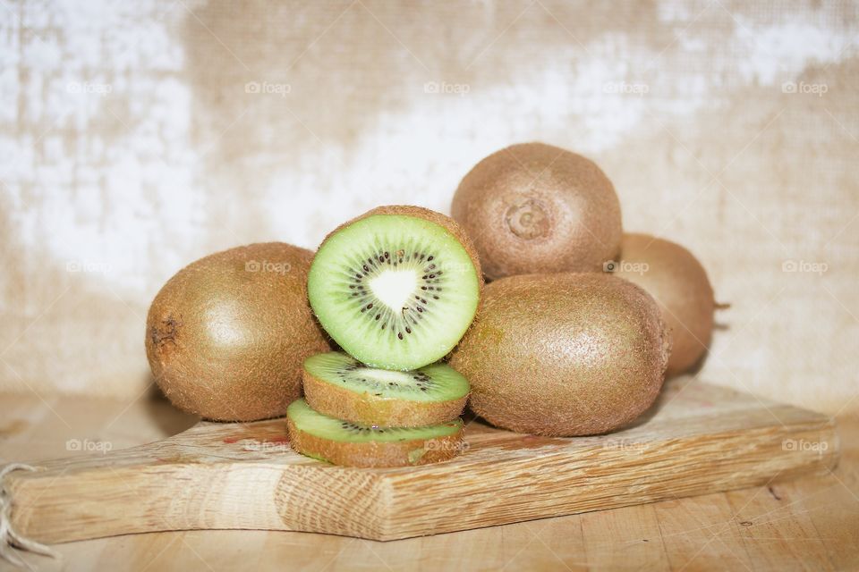 Kiwi fruits on cutting board