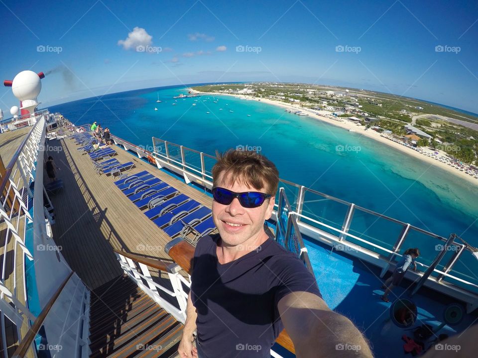 Travel to a tropical island on a cruise ship selfie