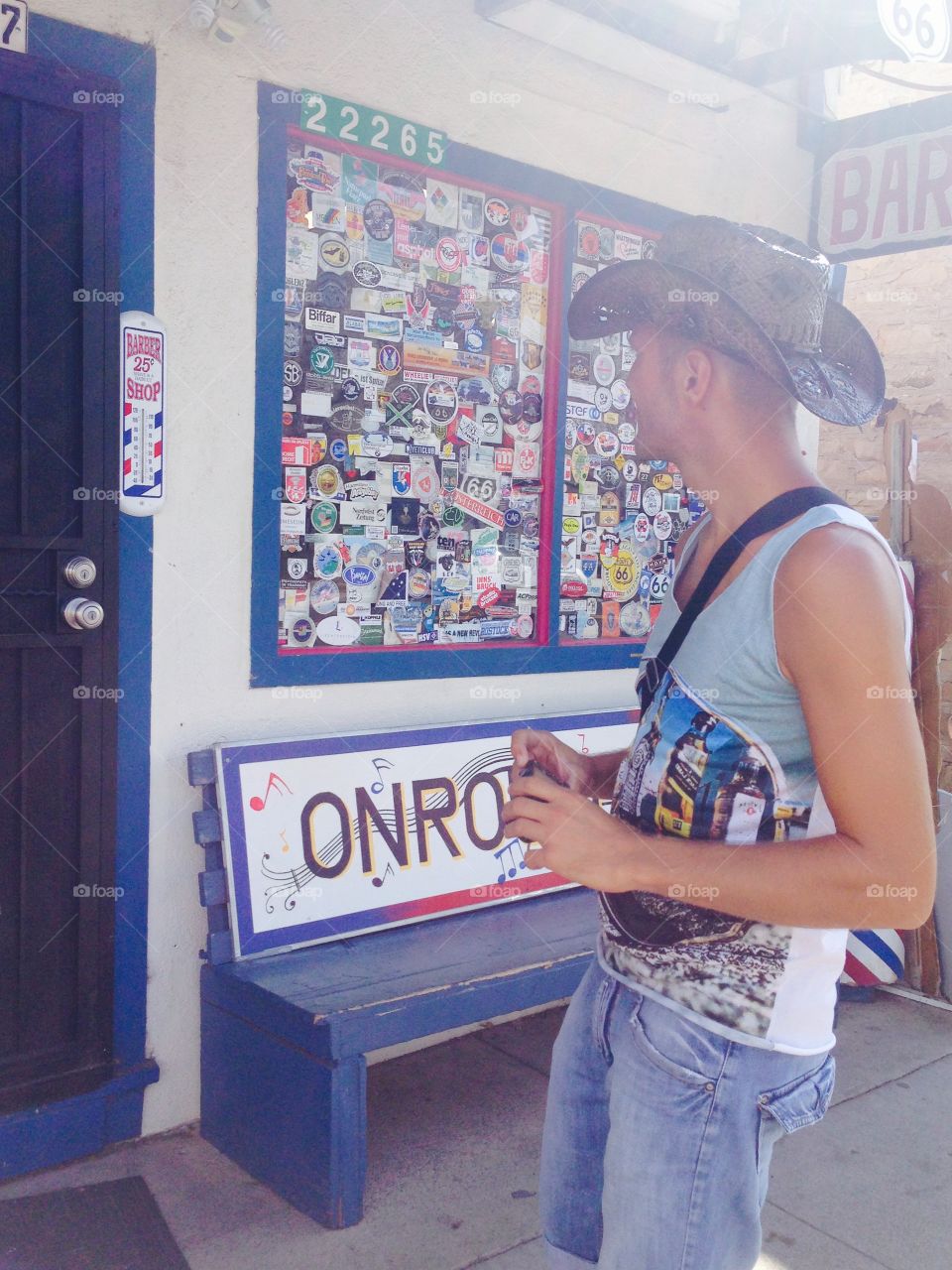 A Man in front of at a colorful gift shop.