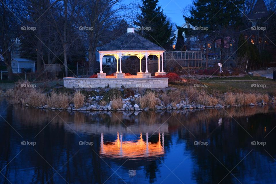 Reflective gazebo. Shot at the waterfalls in Menomonee Falls at dusk has a nice reflection very romantic