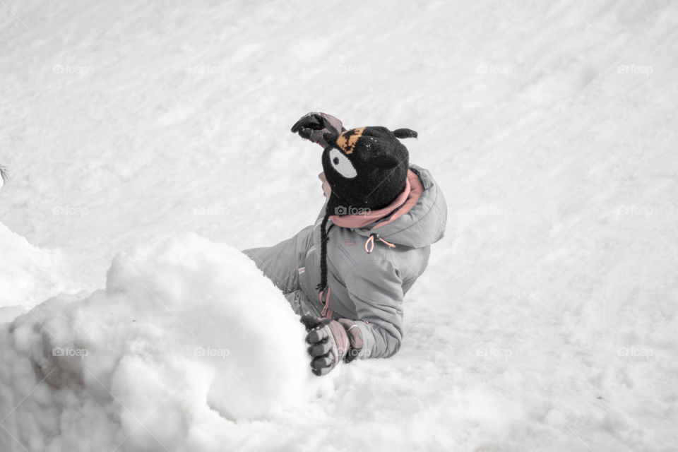 Child playing in the snow