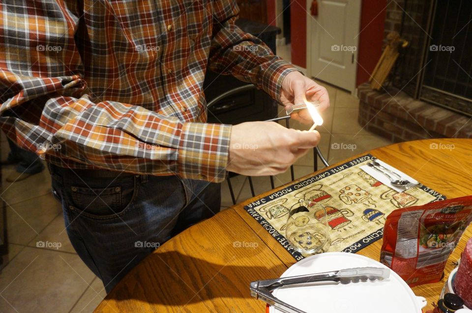 Lighting a match for candles