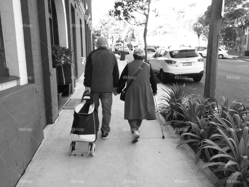 elderly Chinese couple holding hands Sydney Australia
