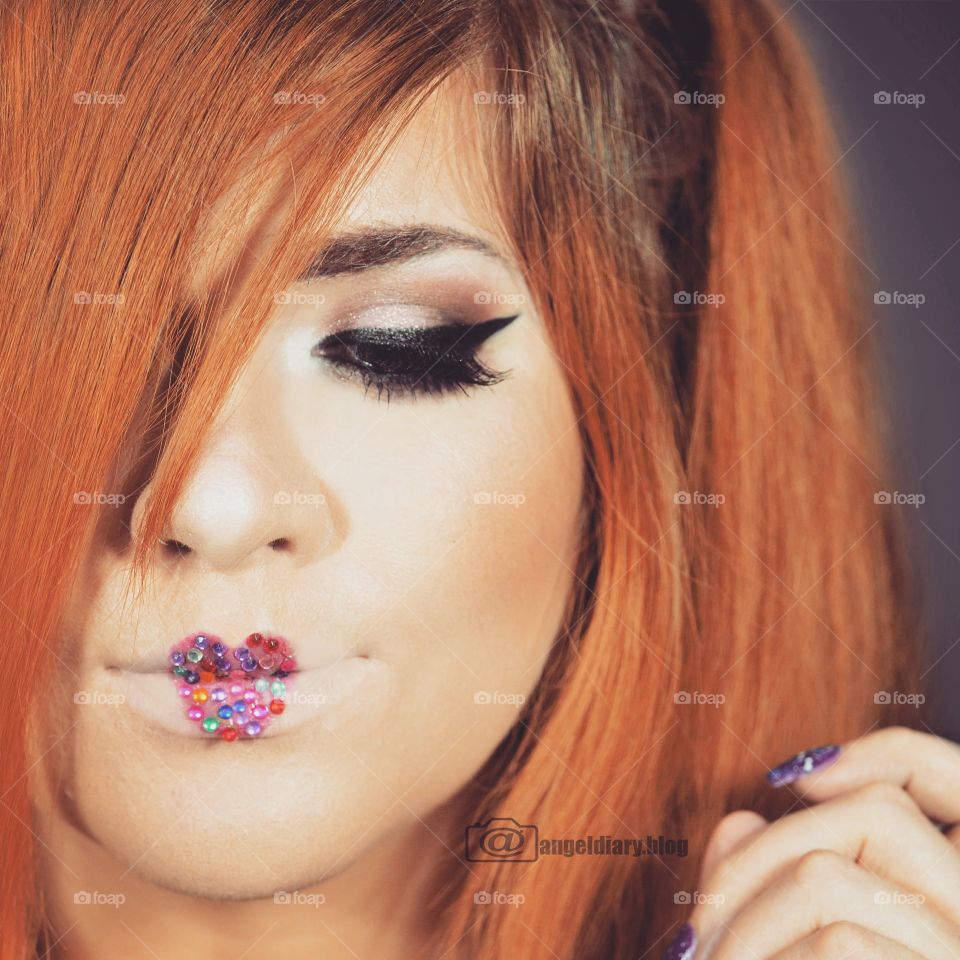 Close-up of woman's face with heart shape lip art