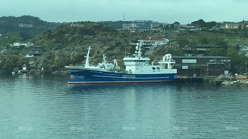 Blue Fishing boat docked 