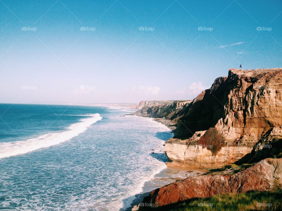 Awesome Atlantic Ocean. Sand beach and cliffs.