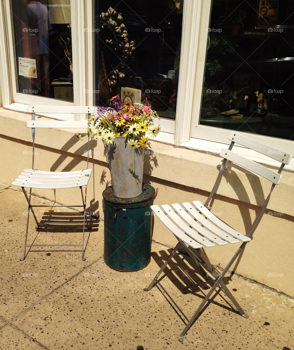 Chairs on sidewalk