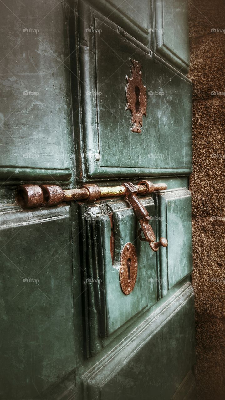 Wrought iron latch on an old door