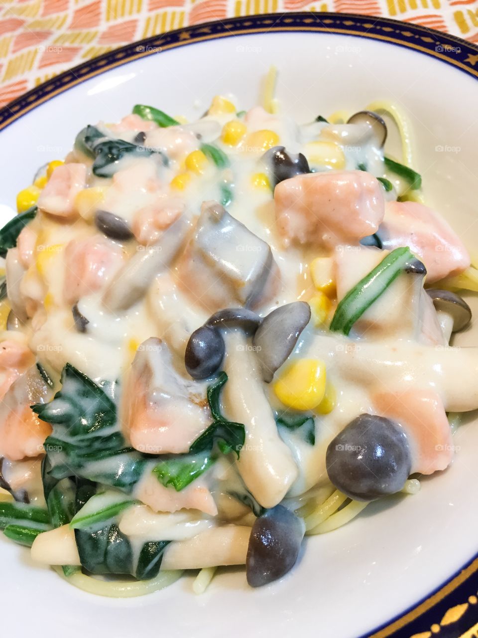 Close-up of pasta with salmon and cream