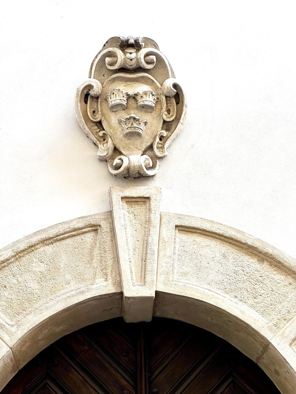 Streets of Krakow. Detail on the facade of the house above the entrance door