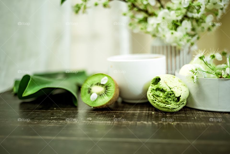 Kiwi and macaroon on table