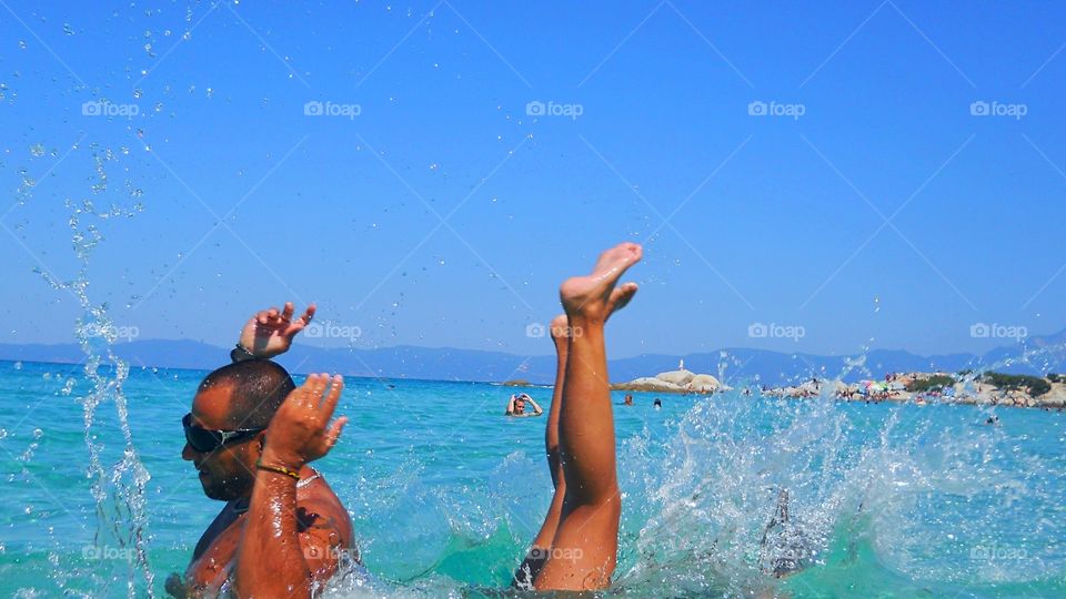 Playing games in crystal water in wonderful sea