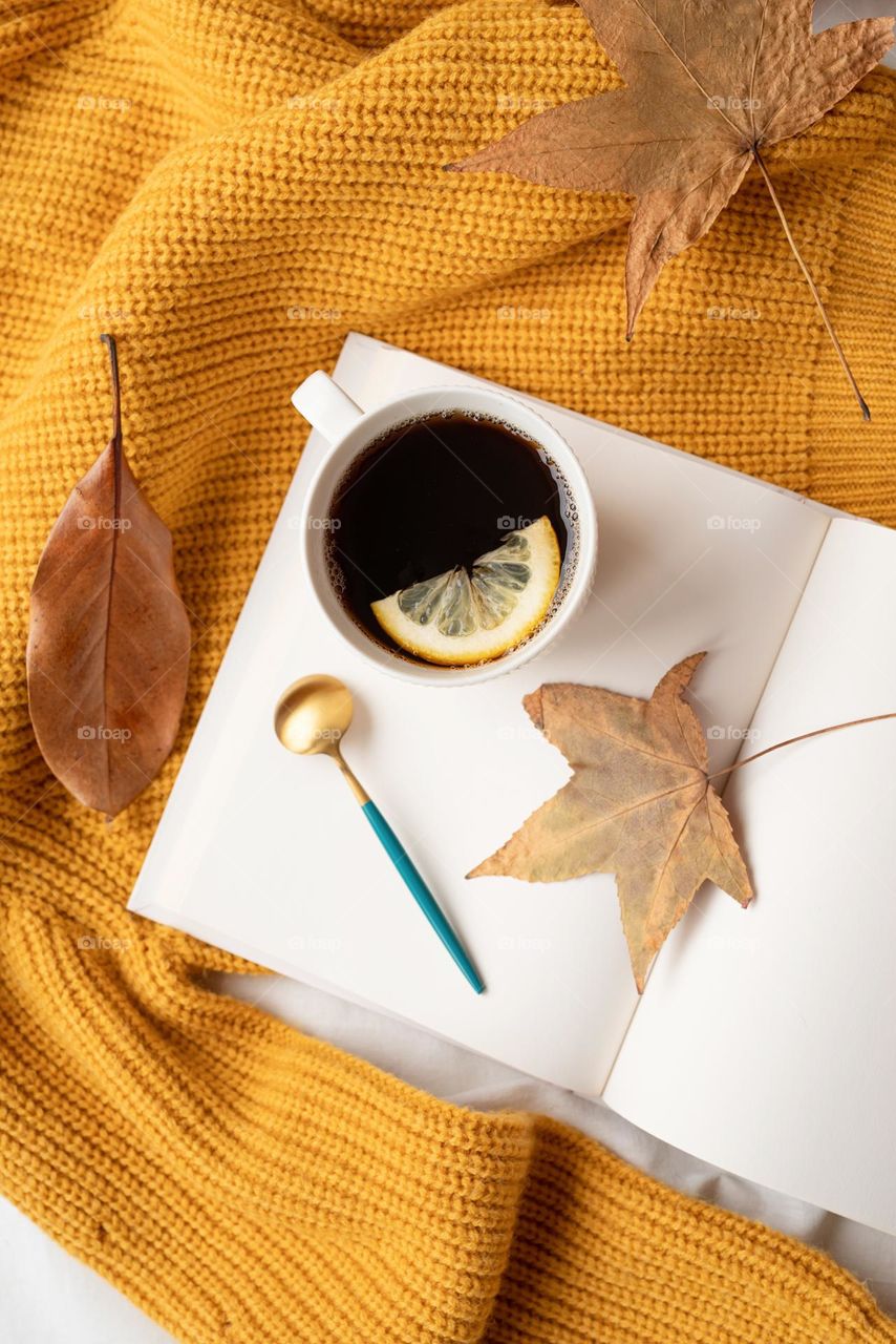 hot lemon tea on yellow sweater