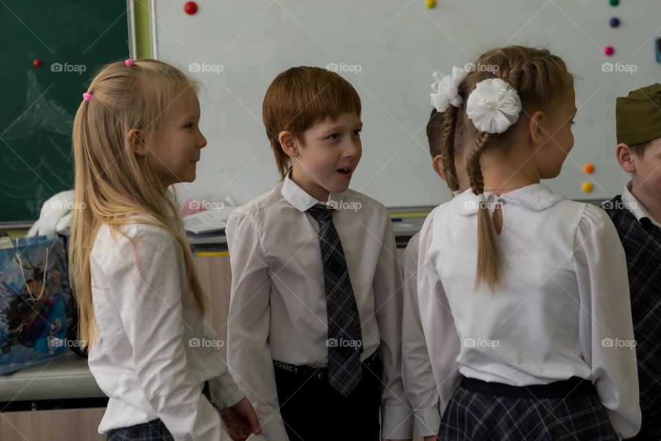 Children schoolchildren on a holiday, bright emotions surprise