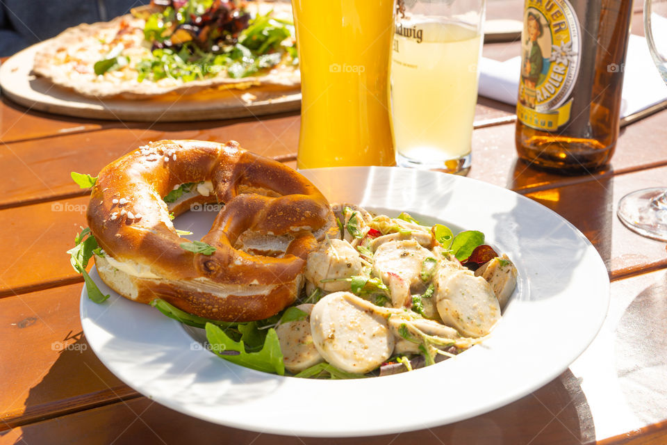 Bavarian Weißwurst salad and pretzel