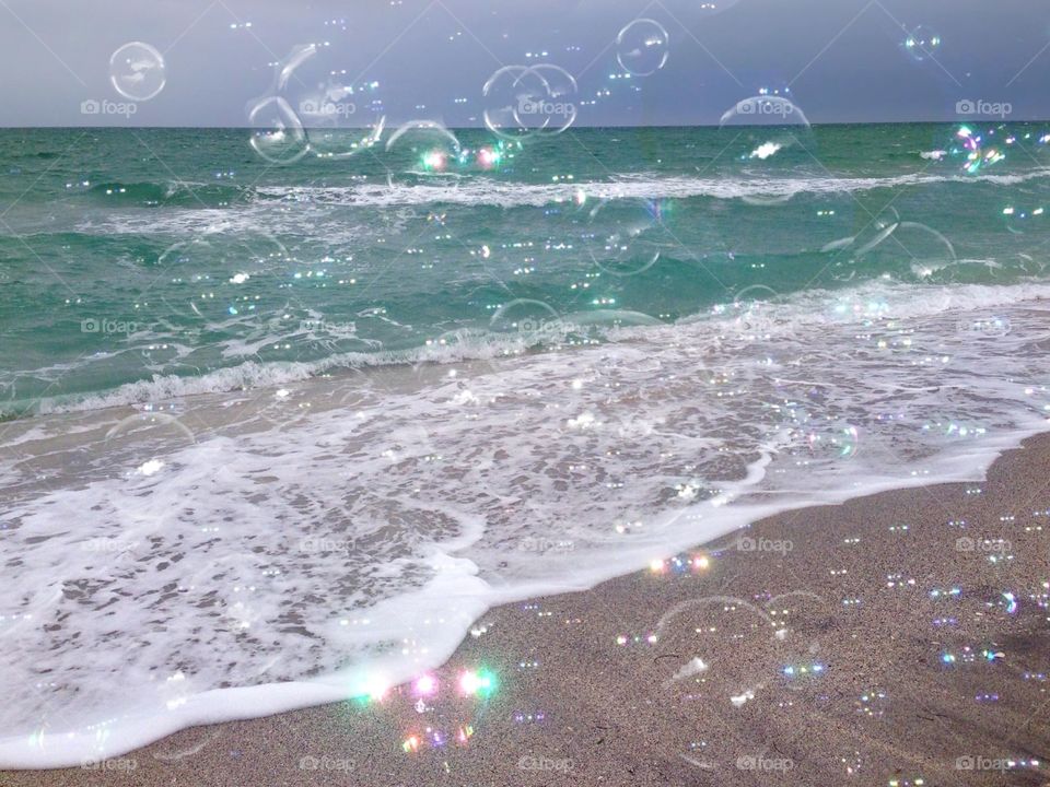 Bubbles floating over the ocean.